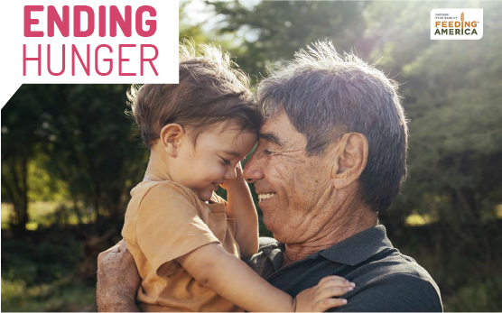 A man holding a child in his arms.